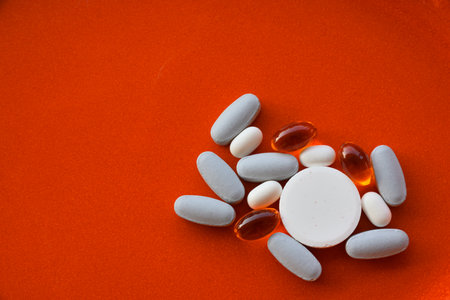 Group of blue, white and orange pills for healthcareの写真素材