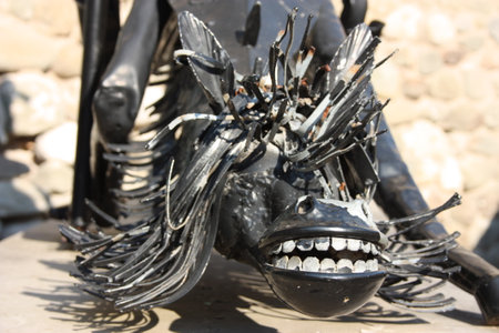 San Panza statue and Don Quixote built in black steel by an unknown author against a medieval brick wallのeditorial素材