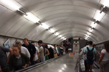 the chaos of the gallery, the escalators that take people and commuters to the London underground...