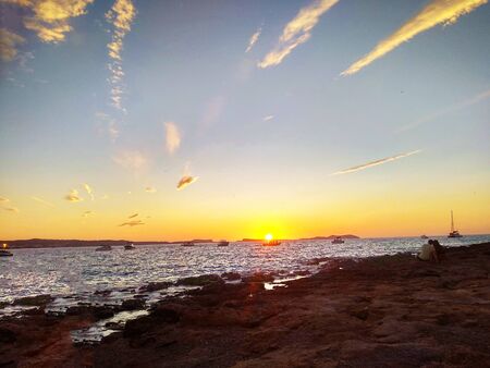 romantic sunset on the coast of the mediterranean sea in ibiza in spain