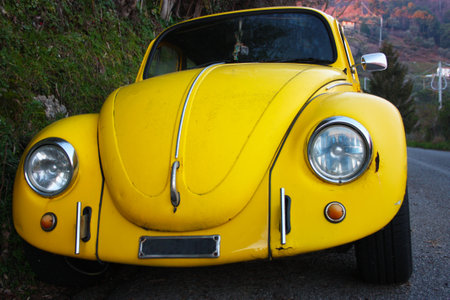 car symbol of a bygone era. vintage style car. old canary yellow transport systemのeditorial素材