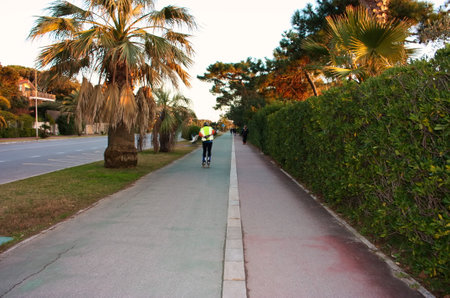 lonely rollerblading skater runs on the sidewalk in the walk in marina di massaのeditorial素材