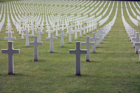 shot of the american military cemetery of the second world war with the crosses of the dead soldiers...