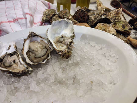 fresh homegrown oysters half-open and ready to be enjoyed at the table