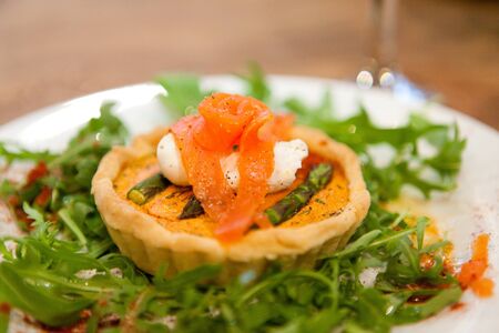 A delicious fresh summery starter Smoked Salmon and asparagus tartの写真素材