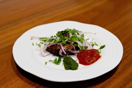 Meatballs with salad and spicy chutneyの写真素材