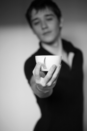 man proposing cup of cuffee to youの写真素材