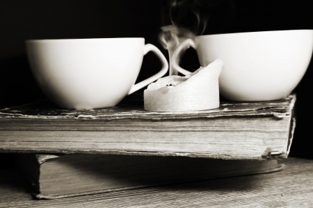 Monochrome image, two cups of coffee and candleの写真素材