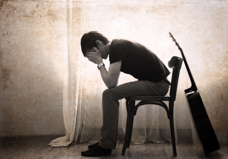 sad man and guitarの写真素材