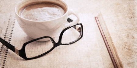 artwork  in vintage  style,  textbook, glasses and cup of coffeeの写真素材