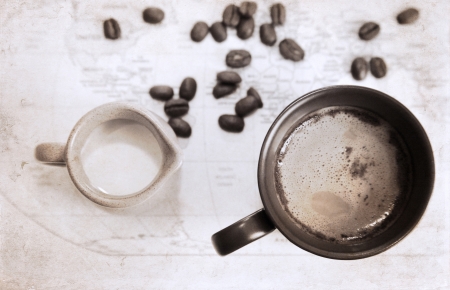 artwork  in grunge style,  two cups of coffee, milk jug, coffee beans, world political map