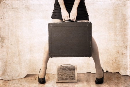 artwork  in vintage style,  beautiful woman holdind heavy bagの写真素材