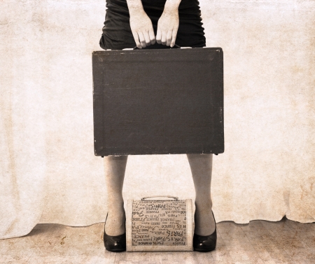 artwork  in vintage style,  beautiful woman holdind heavy bagの写真素材