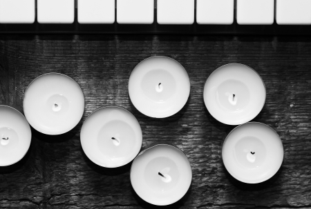 monochrome image, burning candles and pianoforteの写真素材