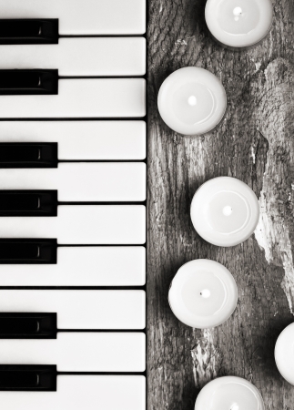 Toned image, burning candles and pianoforteの写真素材