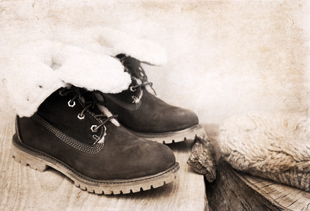 Artwork in retro style, winter warm bootsの写真素材