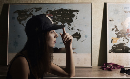 Artwork in retro style, beautiful woman planning the vacation, world mapの写真素材