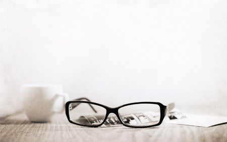 Artwork in retro style, stylish glasses, cup of coffeeの写真素材