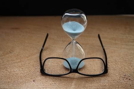 Time running out, sandglass, glasses