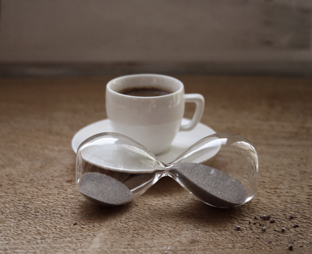 Cup of espresso, hourglass, coffee breakの写真素材