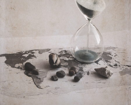 Preparation for the vacation, time is running out, world map, sand glass, sea shellsの写真素材