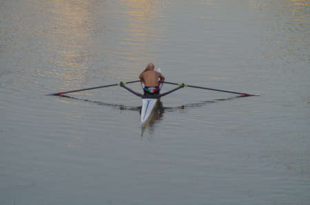 man that answer the cell phone while kayakingの写真素材