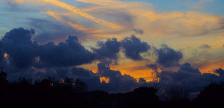 a wide angle picture of a colored sunset of Rome