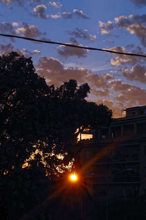 a cloudy sunset with sunraysの写真素材