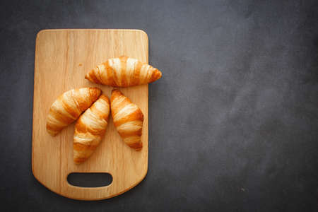 A rich variety of food photography Croissant. Board croissants on white craft paper.の写真素材