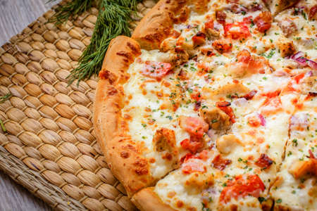 Freshly cooked hot fresh from the oven with a golden crust on the Straw Mat ready-to-eat pizza.