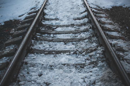 long abandoned and destroyed factory.
Russian winter railway rusty abandoned covered with mud snowの写真素材