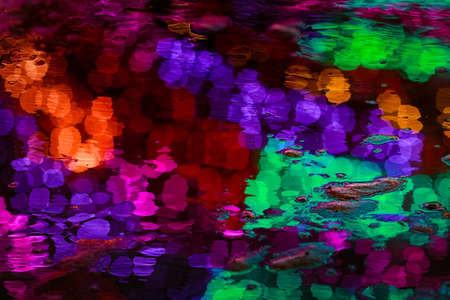 blur effect shooting bokeh on colored lights elimination in the parkfestive illumination in the park bright yellow orange paint of lightの写真素材