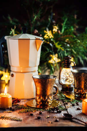 Cup of coffee and christmas decorations on the brown wooden background. Christmas, winter, new year concept.の写真素材