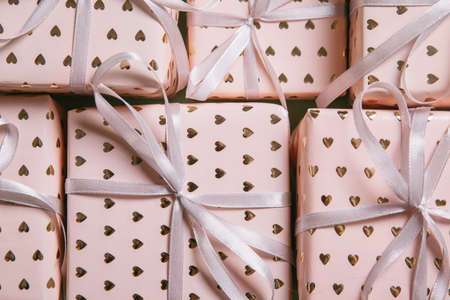 International Women's Day. Valentine's Day background. Gift boxes with ribbons. Valentine's day and...