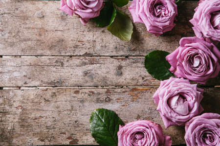 Roses on a wooden background. Valentines day concept. International Women's Day. Mother's day. Flat lay, top view, copy space.の写真素材