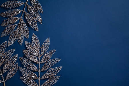Christmas composition. Golden branches on blue background. Christmas, winter, new year concept. Flat...