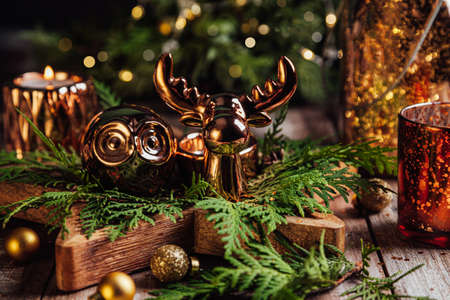Christmas composition with fir branches, Christmas decorations and candles on wooden background. Christmas, winter, new year concept.の写真素材