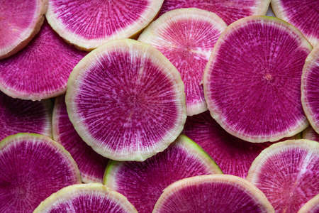 Slices of watermelon radish. Food background. Close up.の写真素材