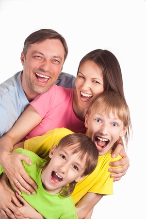 happy family of a four smiling on whiteの写真素材