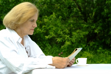 Beautiful Caucasian elderly woman sittingの写真素材