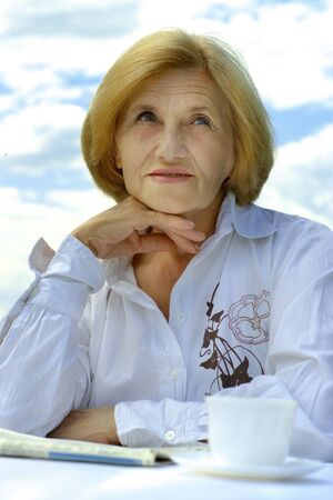 Beautiful Caucasian elderly woman sittingの写真素材
