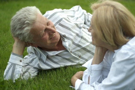 Beautiful Caucasian elderly couple lyingの写真素材