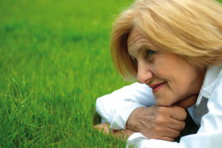 Beautiful Caucasian elderly woman lyingの写真素材