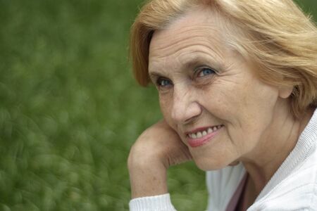 Fine elderly  woman went on the natureの写真素材