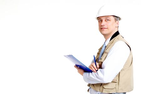 Beautiful man working in the construction helmetの写真素材