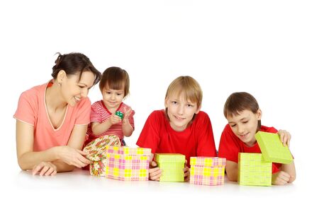 Woman and her children with presentsの写真素材