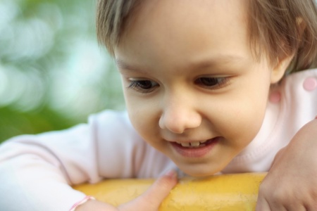 Cute baby walks in the parkの写真素材