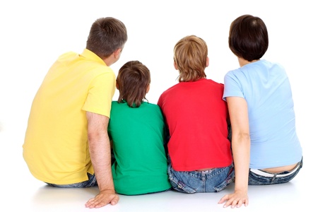 Cheerful family in bright T-shirts have fun in the company of each otherの写真素材