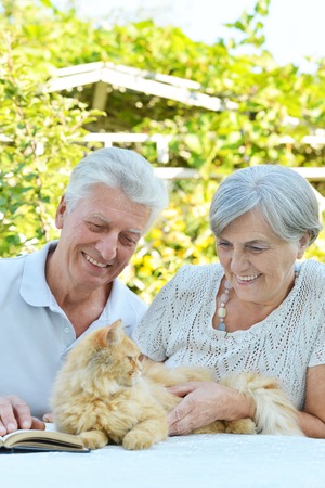 Nice elderly couple together in a summer parkの写真素材