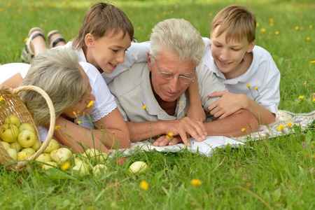Happy family having a picnic on a sunny summer dayの写真素材